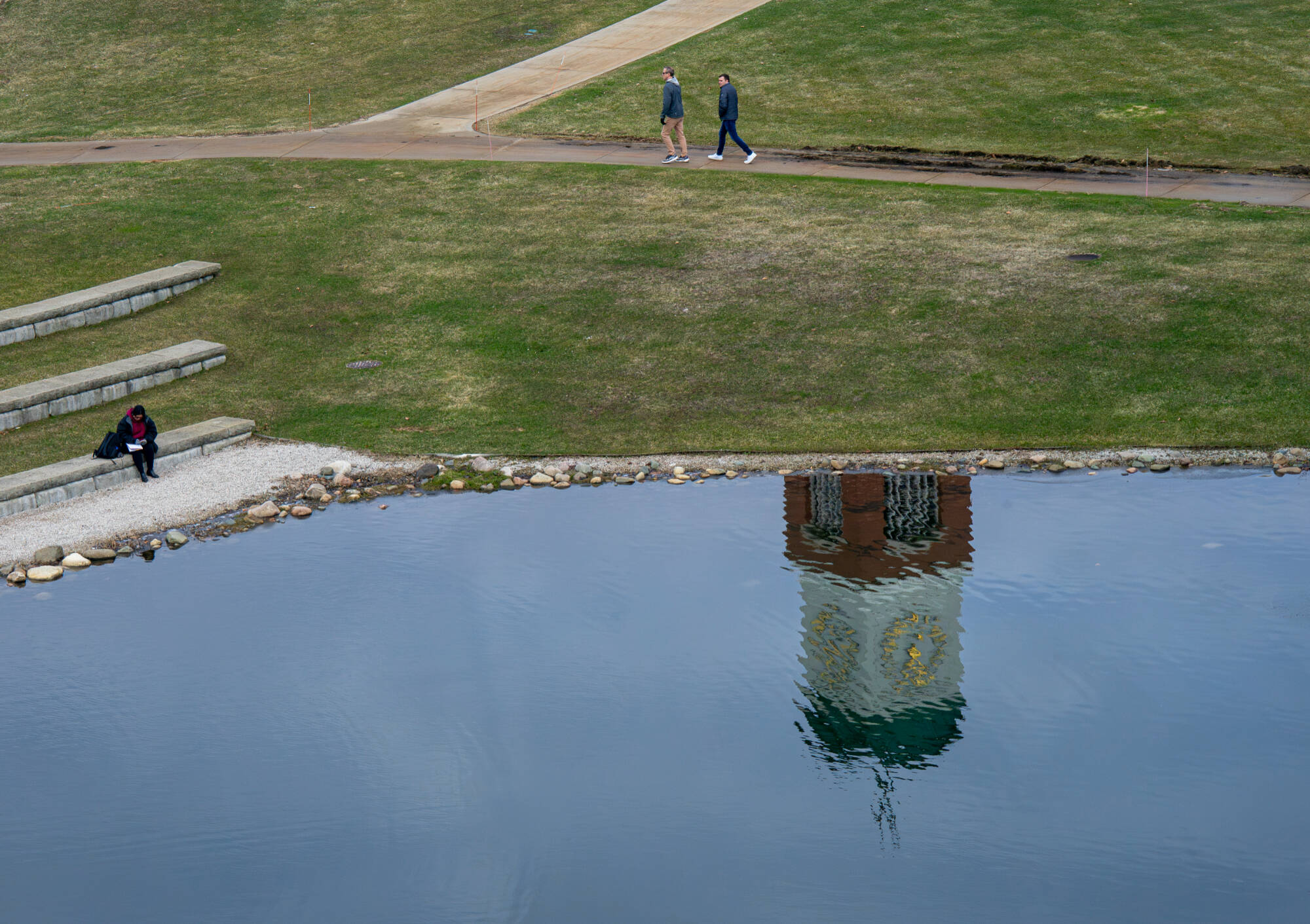 The Cook Carillon Tower is reflected in Zumberge Pond at the Valley Campus on March 19.